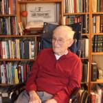 Tom Herring, 96, has an insatiable love for books. He has read and written reviews for hundreds of them and continues to this day with the help of caregiver Zach Krieger. (Anneli Fogt/Staff Photo)