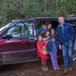King County Council Chair Joe McDermott and Vashon Wilderness Program Executive Director Stacy Hinden with VWP students and the organizations new van. (Courtesy Photo)