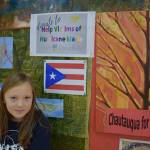 Neko Rogneby with a display for Chautauquas Puerto Rico fundraiser. (Courtesy Photo)