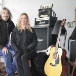 Pete Welch and Allison Shirk of Vashon Events show off some of their many instruments people can borrow for free. (Susan Riemer/Staff Photo)