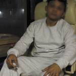 David, whose face has been blurred intentionally in this photo, awaits a ride from the NW Detention Center moments after being released. (Julian White-Davis Photo)