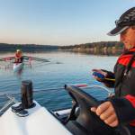 Coach Richard Parr timing a shell on Quartermaster Harbor at sunrise. (Terry Donnelly Photo)