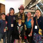 Josh Munger gathers with his wife and children at the recent firefighter stairclimb. (Courtesy photo)