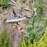The SnoHAWK10 helicopter of the Snohomish County Sheriffs Office on Saturday lowered a rescue technician and flight medic to treat a man who fell while climbing the Index Town Wall. (Snohomish County Sheriffs Office)