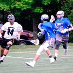 Greg Martin Photo                                 Carlos Hernandez dashes around the Liberty midfielders.