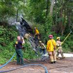 A small brush fire on private property bordering the north-end ferry parking lot was extinguished July 4 (Courtesy Photo).