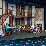 Director Susan Hanson and the cast of Noises Off take a break from rehearsal on the shows two-story set (John de Groen Photo).