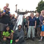 Artist Ela Lamblin, seated center, joins a group of students, parents and teachers for the unveiling of a new sculpture he helped create to celebrate Vashon Artists in the Schools (Courtesy Photo).