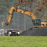 Paving contractor begins to remove millings from island