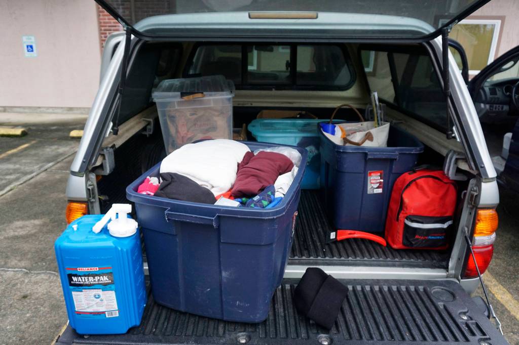 Photo by Melissa Hellmann                                 VashonBePrepared President Vicky de Monterey Richoux keeps several bins with supplies in the back of her car.