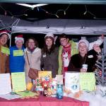 Food bank staff and volunteers gather at the donation table during the Dec. 1 event. (Courtesy Photo)