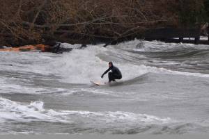 Winter storm brings breakers, and surfers, to the north end