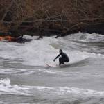 Winter storm brings breakers, and surfers, to the north end