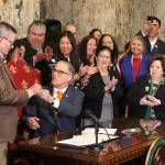 Gov. Jay Inlsee signs into law the Native American Voting Rights Act, which allows a non-traditional address to be used for voter registration for residents who live on reservations. Photo by Emma Epperly/WNPA Olympia News Bureau