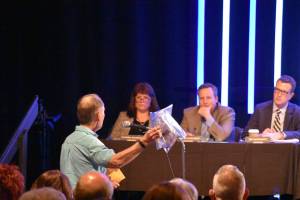 Haley Ausbun/staff photo                                A man addresses the King County Council during a public hearing March 20 at New Life Church in Renton. He presented bags filled with what he said was hazardous materials dropped on his property by bald eagles. Another speaker made similar claims.