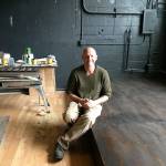 Snapdragon Bakery and Café owner Adam Cone shows off the stage for the restaurants Black Cat Cabaret (Elizabeth Shepherd Photo).