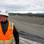 Scott Barden stands next to the pit that will house the newest, and possibly final, section of the Cedar Hills Regional Landfill near Maple Valley. The pit is 120 feet deep, and around another 180 feet will be built on top of it over the next decade (Aaron Kunkler Photo).