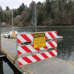 Barricades block access at Dockton Marina after the piers and breakwater suffered significant structural damage this winter. (Susan Riemer/Staff Photo)