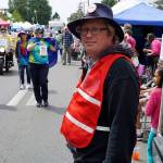 Jim Marsh, executive director of Vashon Island Chamber of Commerce, can often be spotted during the festival wearing a bright safety vest as he bicycles between events (Pete Welch Photo).