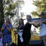 Brian Brenno holds up the custom skate deck painted by Pam Ingalls (Paul Rowley/Staff Photo).