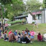 Storytime for children attending the Picnics in the Parks program draws a crowd last year (Paul Rowley/Staff Photo).