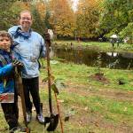 Mother-and-son duo Nolan and Hannah Morosoff pose for a photo on Saturday, Oct. 19, after planting trees with the Land Trust (Kate Dowling/Staff Photo).