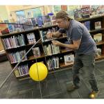 Island man creates, installs solar system mobile