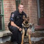 Officer David Stone of the Spokane Police Department K-9 unit poses with 19-month-old German Shepherd, Haywire (Spokane Police Department Photo).
