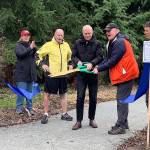County officials joined the Land Trust for the unveiling (Kate Dowling/Staff Photo).