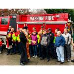 Father Tryphon blesses Engine No. 7 and the VIFR team (Kate Dowling/Staff Photo).