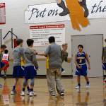 Coach Robin Magonegil with her middle school basketball team. (Kelly Keenan Photo)