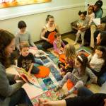 Children and parents are read a story at Family Place on Martin Luther King Jr. Day (Emma Cassidy Photo).