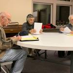 Vashon Health Care District commissioners (left to right) Eric Pryne, Don Wolczko and Wendy Noble talk to attendees of the meeting moments before it convenes on Feb. 5. (Kevin Opsahl/Staff Photo)