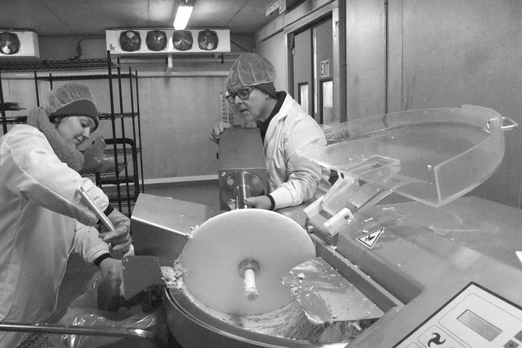 Employees at Rebellyous prepare plant-based chicken nugget dough. The company sells to commercial kitchens, and is hoping to expand in the coming year. Aaron Kunkler/staff photo