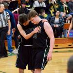 VHS boys basketball player Isaac Patchen, left, embraces Finbar Anderson seconds after the regional playoffs ended on Friday, capping the Pirates 2019-20 season. (Pam Stenserson Photo)