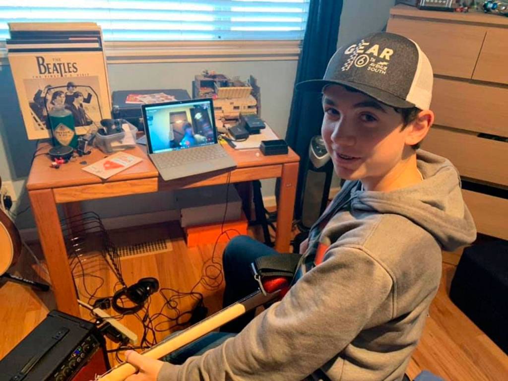 Mode Music Guitar student Sam Sweetland takes an online guitar lesson from Zander Yaets, of the band Tres Leches (Courtesy Photo).