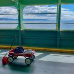 A lone red wagon waits for its destination crossing Puget Sound last weekend. Washington State Ferries said that recent system-wide ridership has been down about 75 percent compared to the last week of February (Tara Morgan Photo).