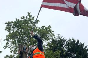 Veterans carry out a somber task on Memorial Day