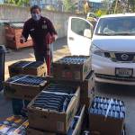 Troy Wageman, the project coordinator for the operations team, gives a thumbs up for a Maven Meals delivery (Courtesy Photo).