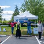 Medical Reserve Corps and Community Emergency Response Team crew demonstrate social distancing before getting down to work at their new location. Testing for COVID-19 is now at the Open Space for Arts & Community (Michelle Bates Photo).