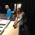 Amy Broomhall, Gabe Dawson and Micheal Golen-Johnson (seated at table, in background), created live foley (sound effects) for Home, a set of seven short radio plays produced by Vashon Repertory Theatre (Susan McCabe Photo).
