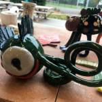 These two ceramic monsters are examples of work created in an innovative annual art project that pairs kindergartners and high school students (Courtesy Photo).