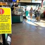 In mid-March, customers still entered Vashon Thriftway unmasked, but signs warned customers to distance from each other (Kevin Opsahl Photo).