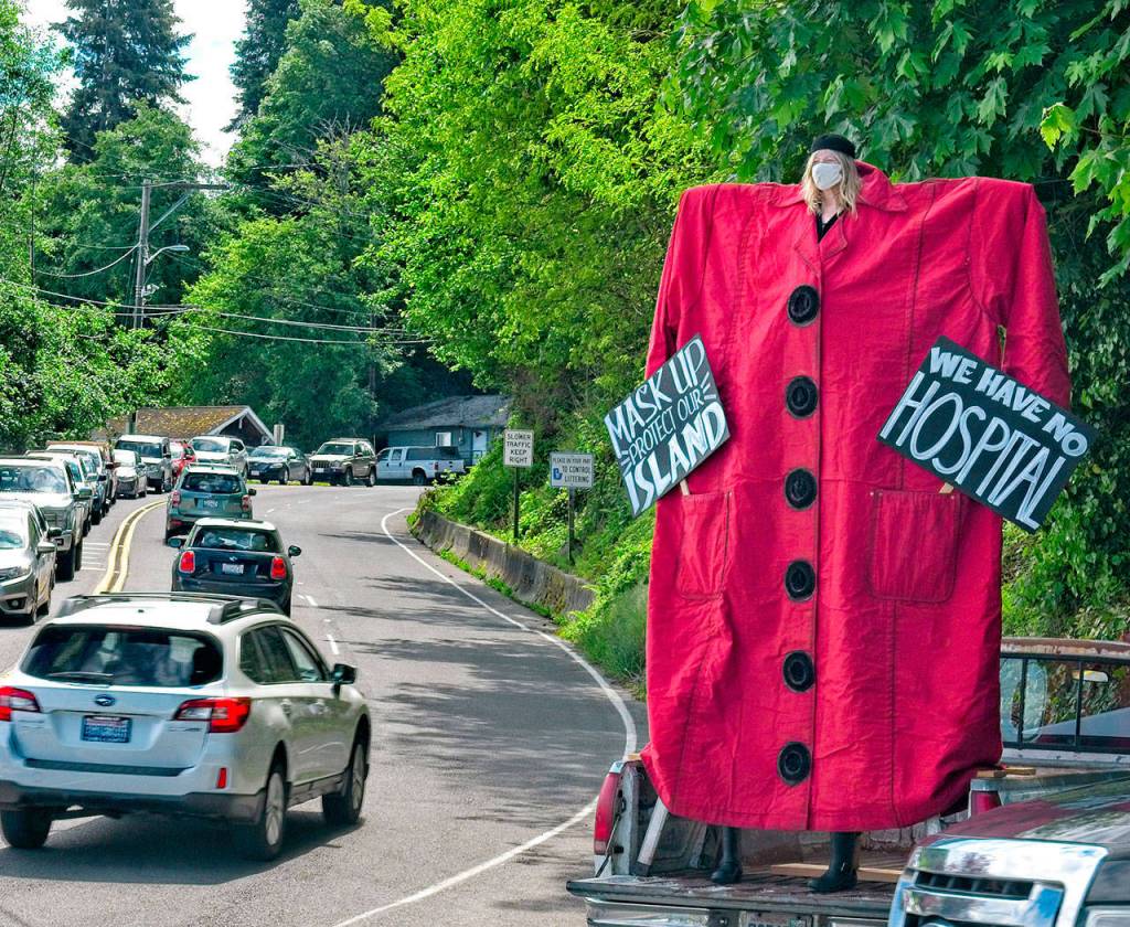 In May, island theater artist Mik Kuhlman created her first pandemic street performance, urging visitors of Vashon to mask up (Jeff Dunnicliff Photo).