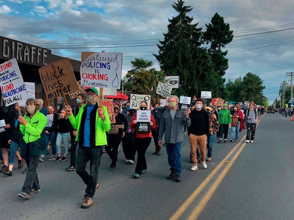 In June, islanders lined one side of Vashon Hwy. in a 1,000-person march, responding to the call of Black Lives Matter Seattle-King County for marches and a general strike throughout Washington State (Tom Hughes Photo).