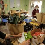 Volunteers at Vashon Food Bank pack customized grocery orders for home delivery. The food bank has adapted with COVID-19 to feed the community (Photo Courtesy Vashon Food Bank).