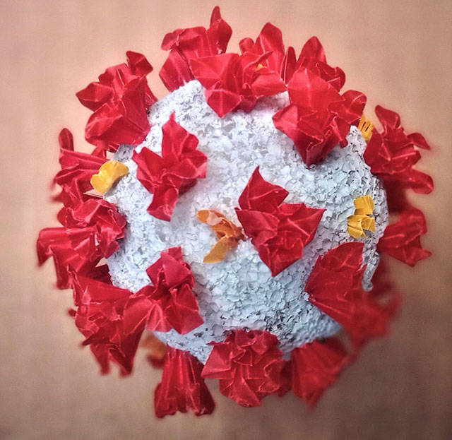 Origami artist Alice Larson has created COVID-19 balls based on the often seen Centers for Disease Control and Prevention image (Courtesy Photo).