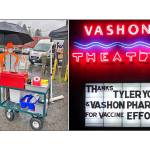 At last weeks All Hands Briefing, open to all our pandemic volunteers, the group thanked Tyler Young, owner of Vashon Pharmacy, for his community service, which has required a major disruption to his store as well as risking thousands of dollars to offer the drive-through vaccinations to the community. He is shown here on the left with his injection support cart during a day where operations continued despite the pouring rain. Thanks also went to Vashon Print and Design (printing services and information), Vashon Theatre (parking lot), and Island Queen (restrooms) for their ongoing support of the vaccination site. In typical Vashon style, people have been offering pastry and other food to workers at the vaccination site. Sadly, no fresh food items are allowed at either the vaccination site or the testing site, because exchanging or gathering for food could be a vector for disease transmission (Courtesy Photos).