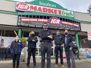 Tom Hughes Photo
(Left to right) Vashon IGA workers Melissa Alumbaugh, Travis Waschenbach, Shawn Hoffman, Charlie Hoffman and Josh Taylor have endured a pandemic year, face to face with the public. Now, they are up next for vaccination, according to Gov. Jay Inslees revised priorities for groups of workers.