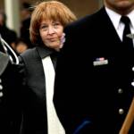 Kathy Parks, wife of slain firefighter Gary Parks, walks in a processional to place a flower on the memorial for her husband on the Everett Community College campus in 2012. (Michael OLeary / Herald file)